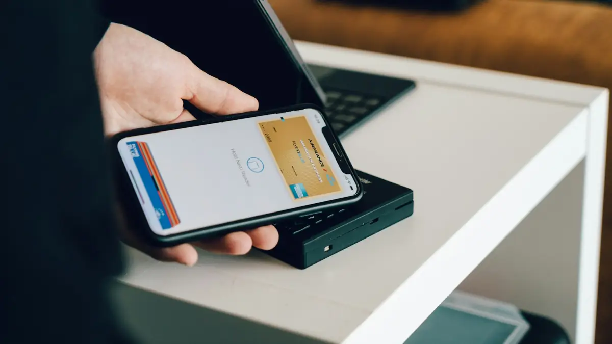 Person paying with their phone at a card reader