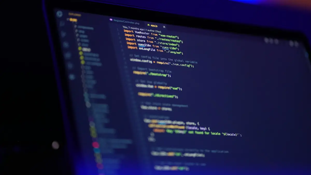 Laptop screen showing colorful programming code