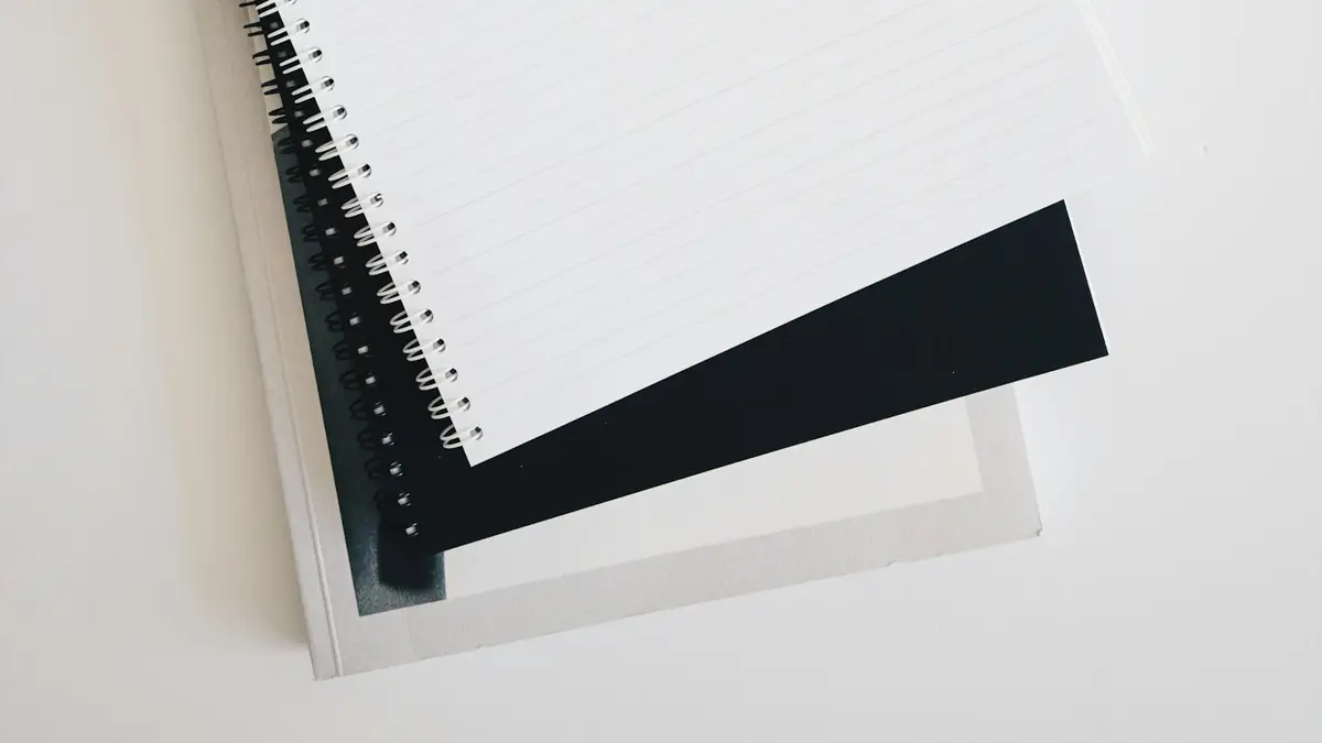 Open spiral notebook on a white desk